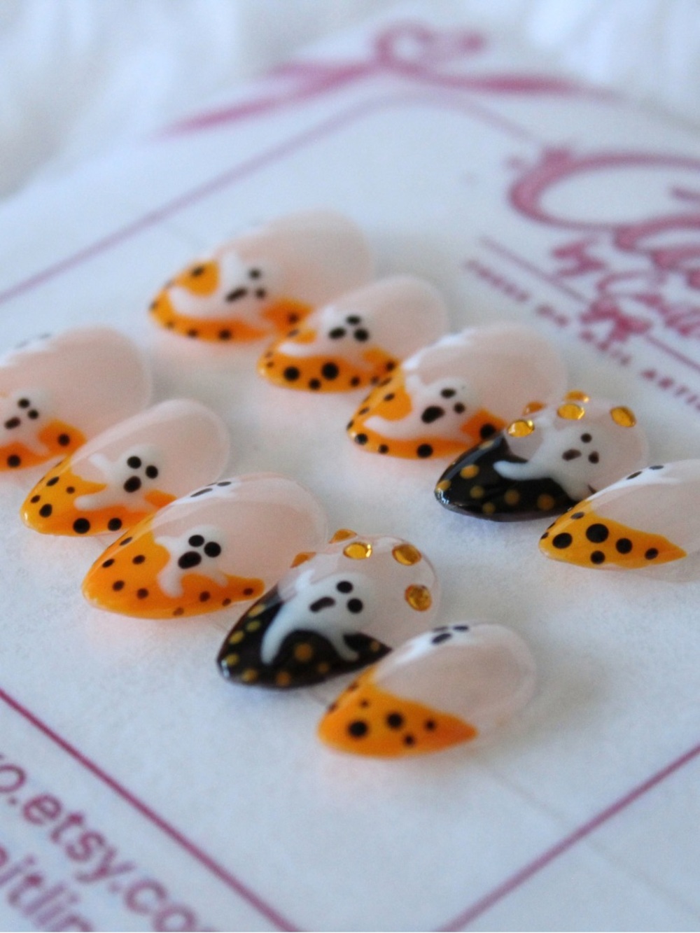 Orange and black Halloween tips with ghost accents